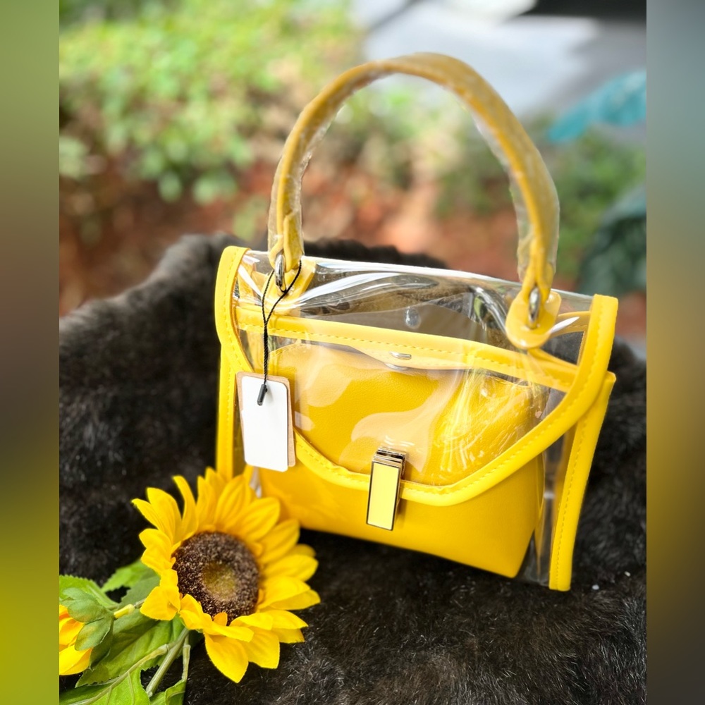 New clear, single strap 8x8 yellow trim purse. Includes wallet/shoulder strap.